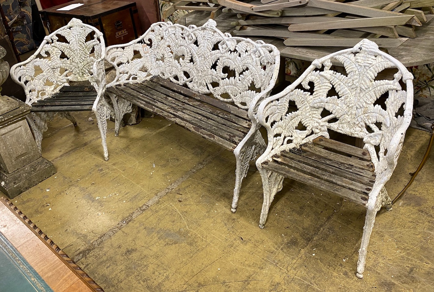 A Victorian style fern pattern painted cast metal garden bench and two chairs, length 151cm, depth 55cm, height 90cm
